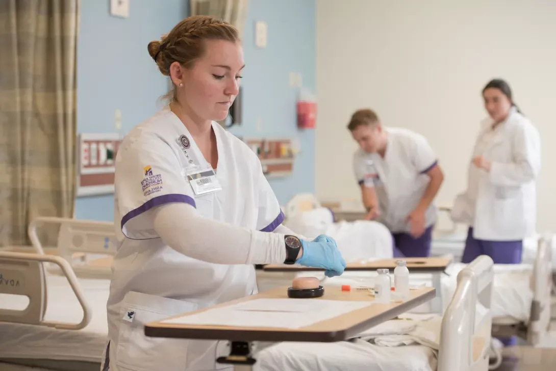 Nursing student preparing supplies