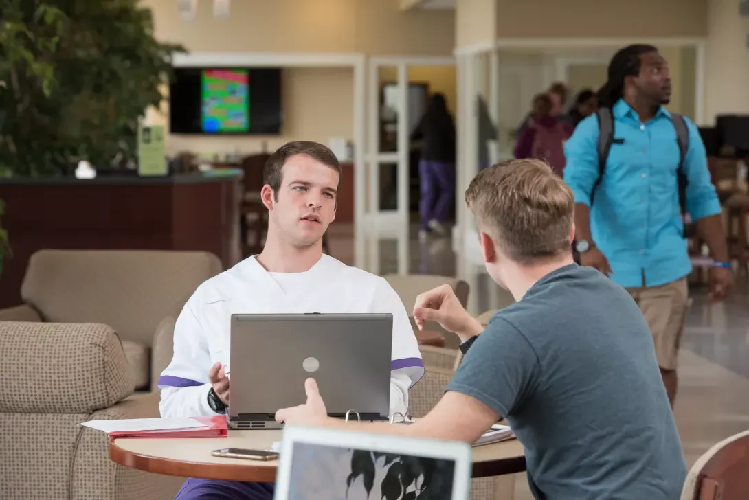 Nursing students with a laptop computer