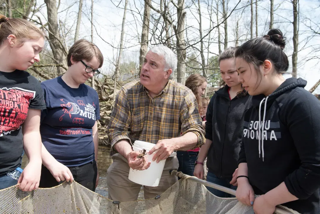 Students with Professor Stoffer, examining animals found in stream at Canfield Preserve